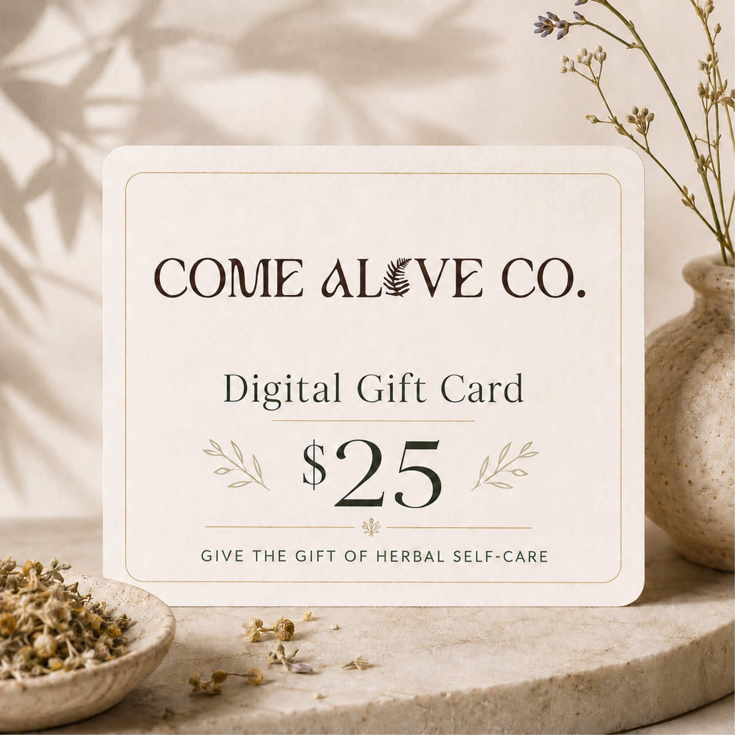 Come Alive Co. $25 digital gift card for herbal self-care, displayed on a cream card with botanical accents, dried herbs, and luxury wellness styling.
