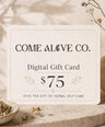 Come Alive Co. $75 digital gift card for herbal self-care, displayed on a cream card with botanical accents, dried herbs, and luxury wellness styling.