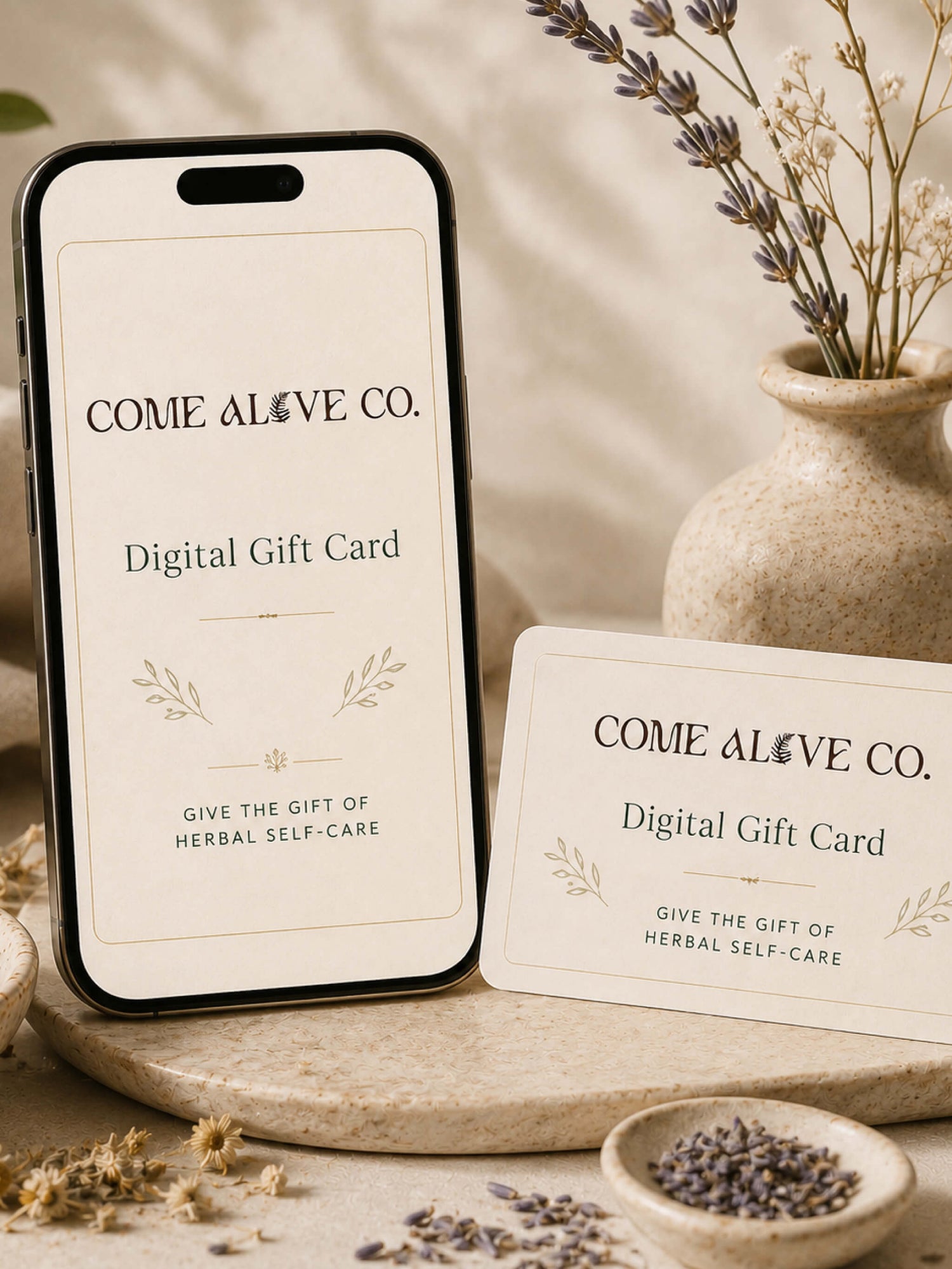 Come Alive Co. digital gift card for herbal self-care, displayed on a cream card with botanical accents, dried herbs, and luxury wellness styling.