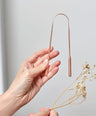 Pure copper tongue scraper designed to gently remove bacteria and toxins from the surface of the tongue