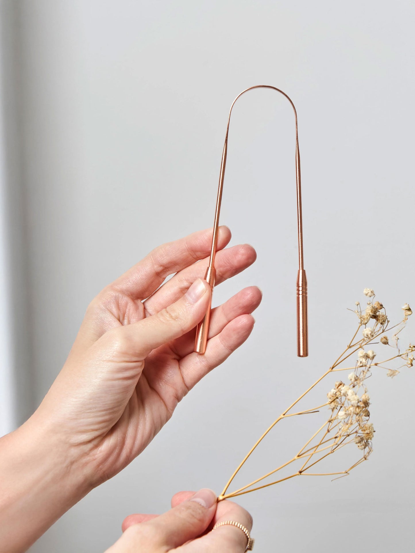 Pure copper tongue scraper designed to gently remove bacteria and toxins from the surface of the tongue